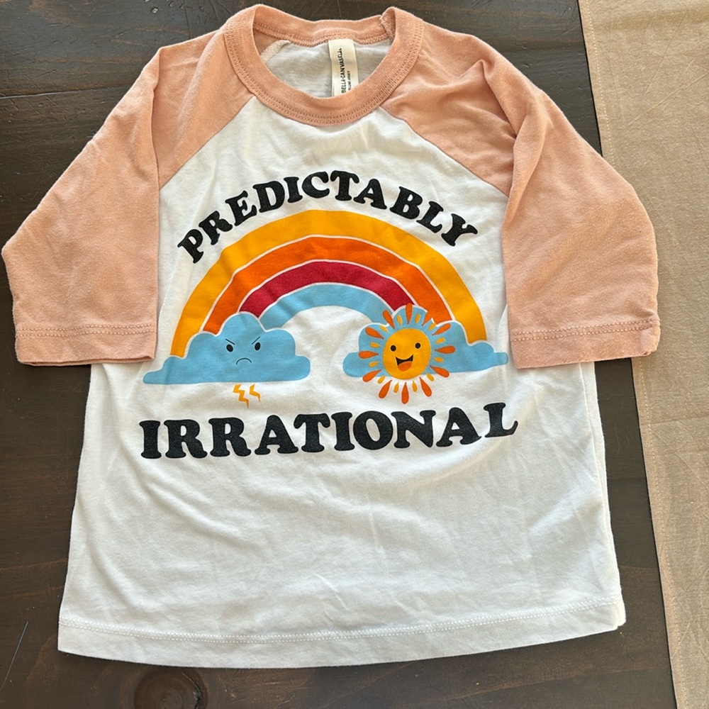 Bella and Canvas kids baseball style T-shirt. “Predictably irrational” Size 3T.